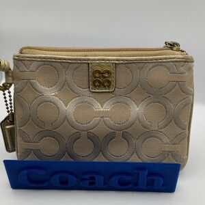 EUC Coach Gold Khaki Julia Op Art Canvas wristlet pouch.